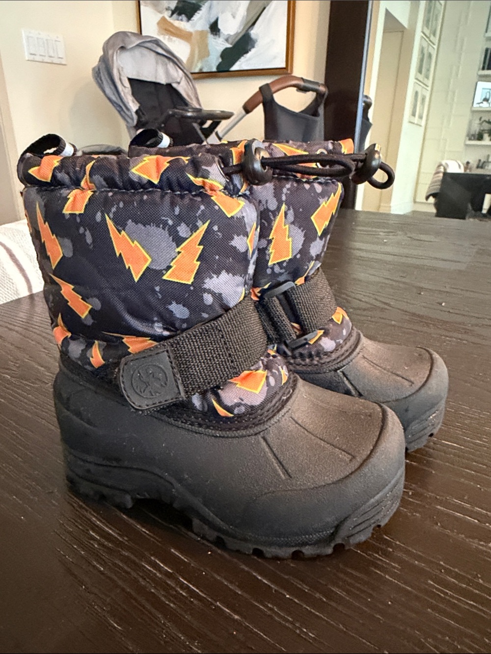 Northside Black Snow Boots with Orange Lightning Print